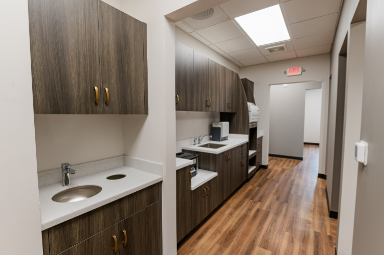 Room with sinks and cabinets