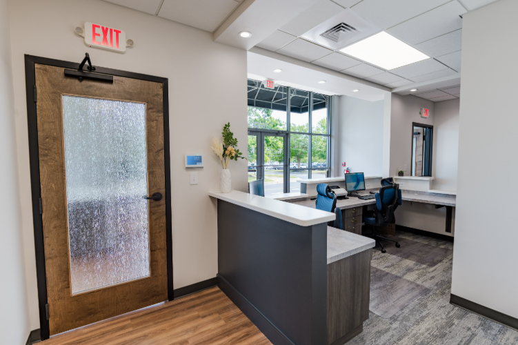 Reception desk and partial view of waiting area.