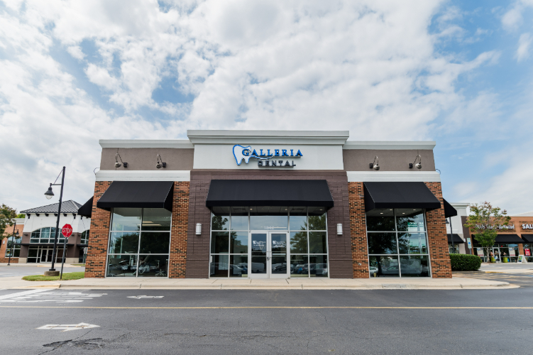 Exterior of Galleria Dental with signage and windows.