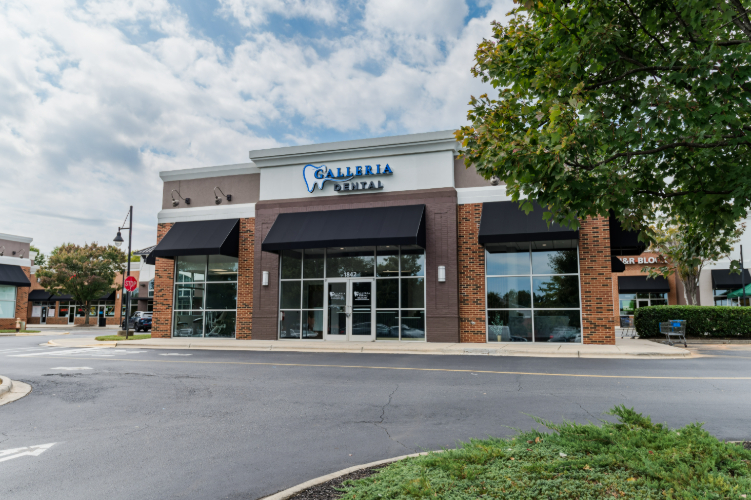 Exterior of Galleria Dental with signage and windows.